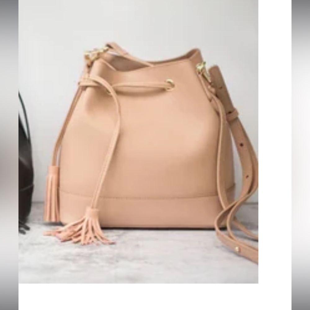 100% Leather bucket bag/backpack with tassels and matching coin purse attachment